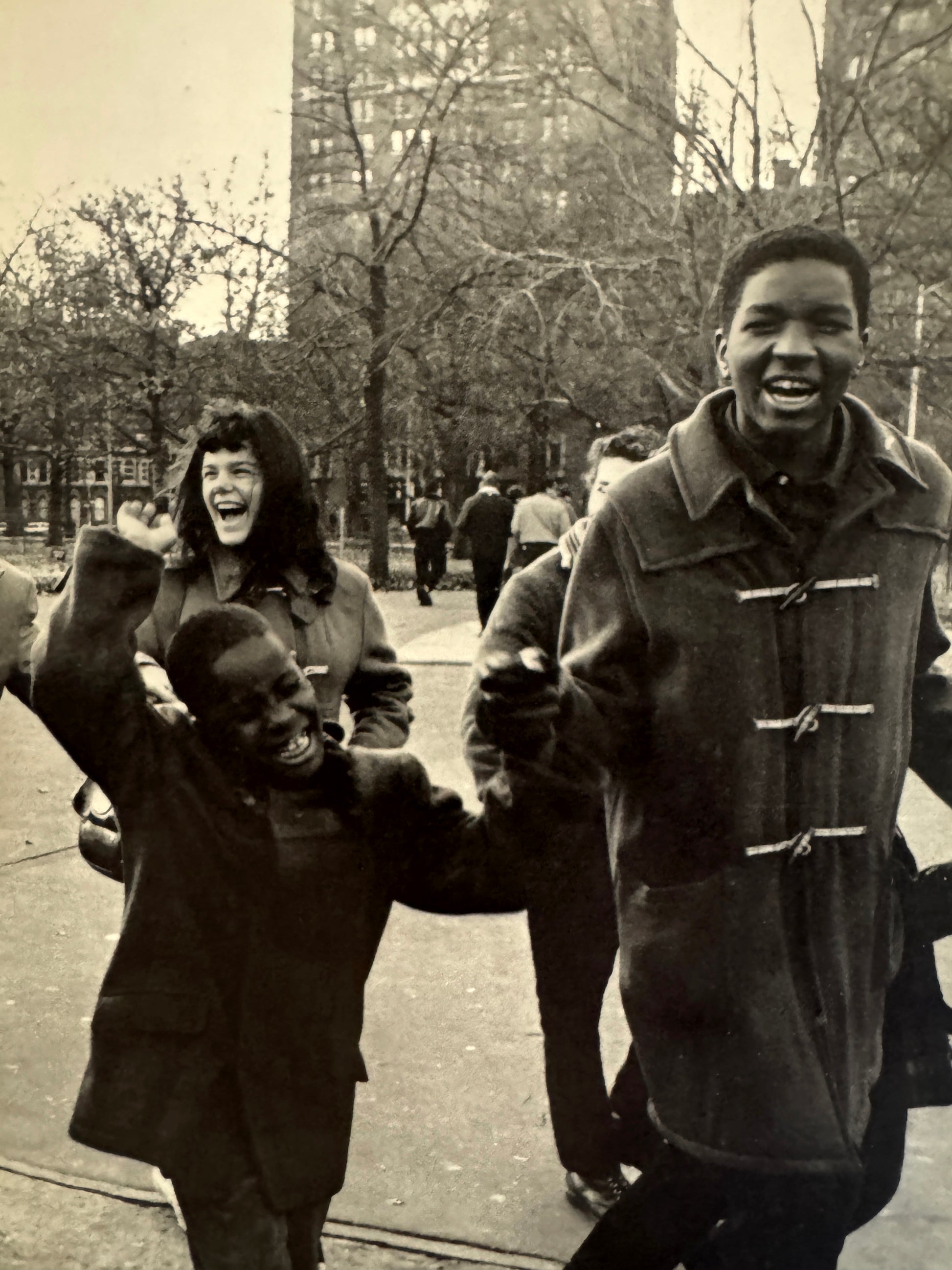 Interior shot - SUMIHARU WATANABE
Face of Washington Square (Washington Hiroba no Kao), 1965. Black and white photo of people on a city street with trees and buildings in the background